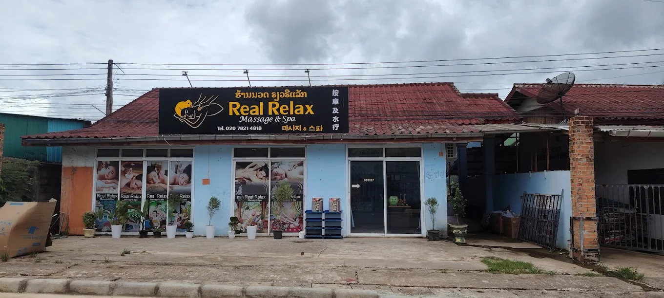 Real Relax Massage & Spa storefront exterior with sign and windows