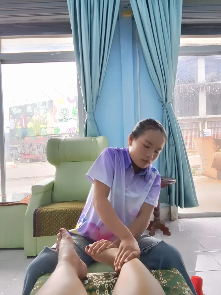 Foot reflexology massage service in progress