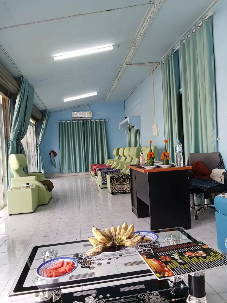 Reception and waiting area with comfortable seating and fruit display