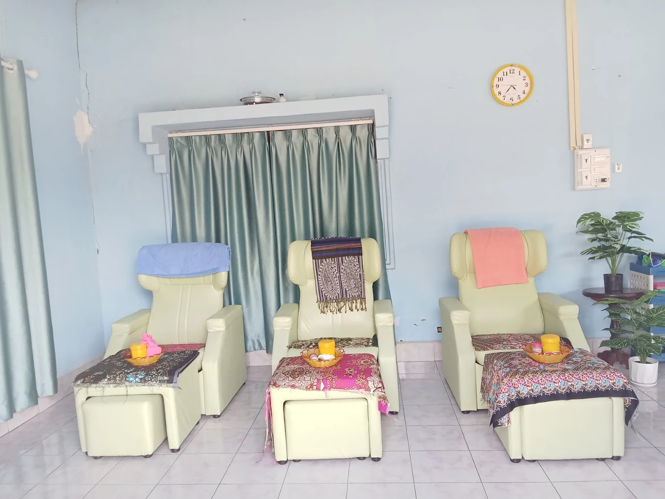 Foot massage area with comfortable recliners and footstools